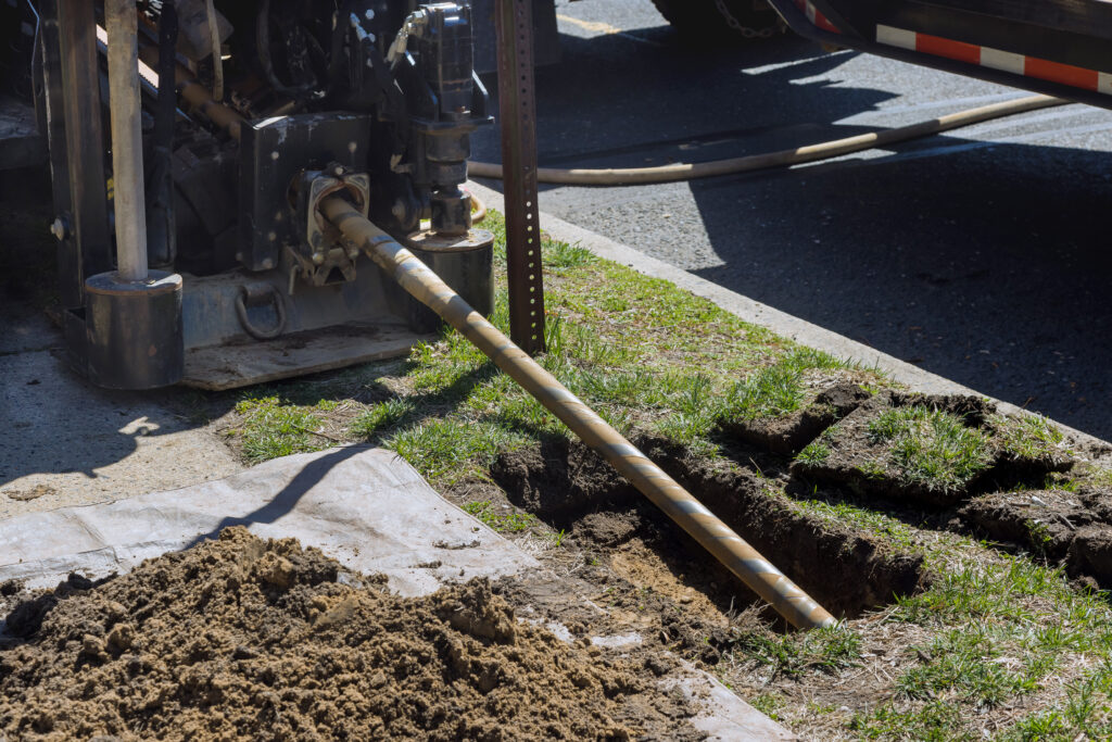 Low angle view of trenchless laying of communications, pipes and water pipes