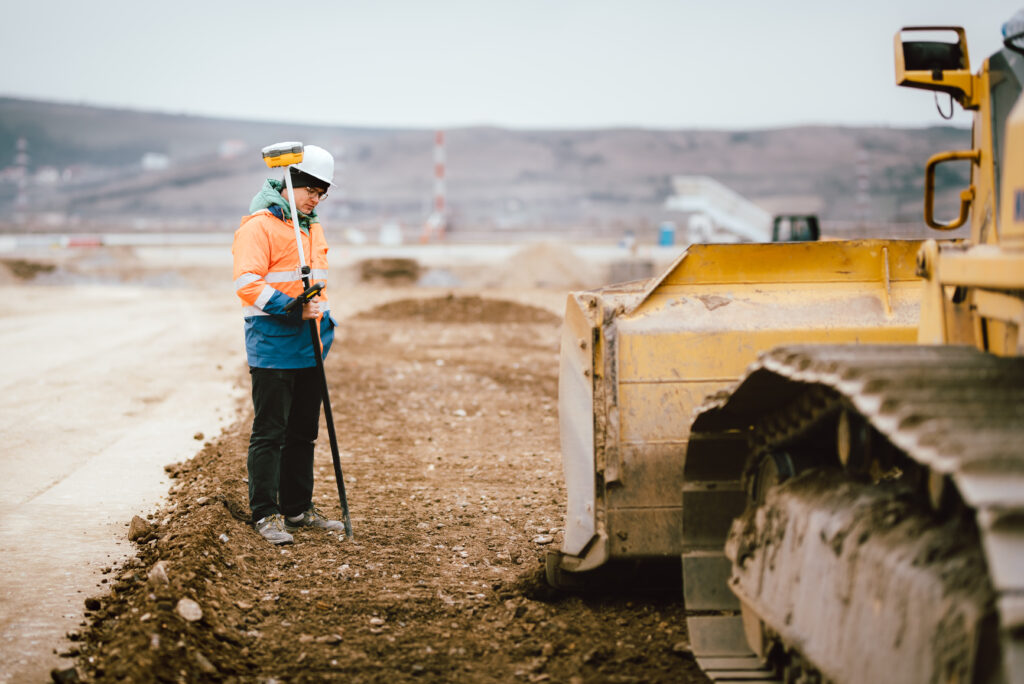 Geodesy details - construction site workers building highway and roads. Surveying engineer details